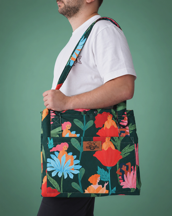 Loud and Proud Bag to Mat worn over the shoulder, with a colourful botanical print