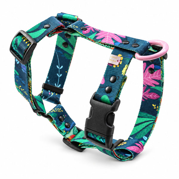 Rainfurrest Y-shaped dog harness with green and pink tropical leaves on dark teal webbing, black buckle and pink D-ring