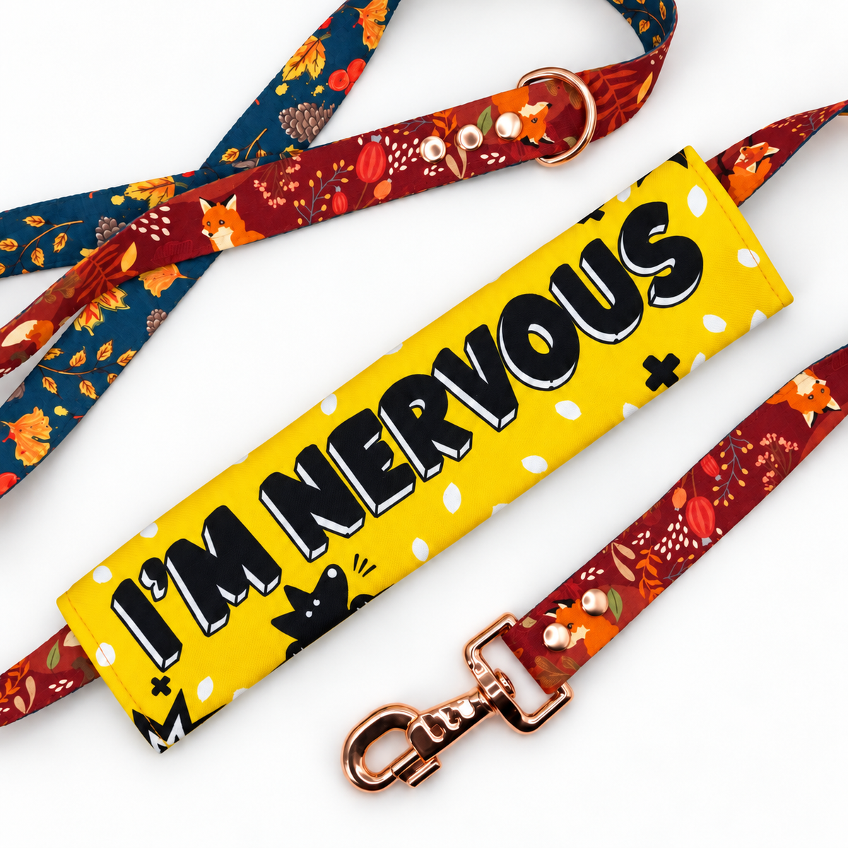 I'm Nervous dog lead sleeve on a red and blue patterned lead.