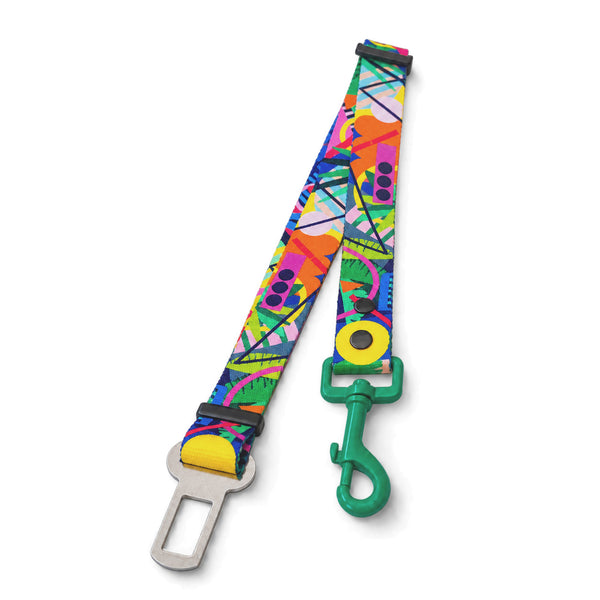 Kaleidogscope dog car seat belt with multicoloured geometric print and a green clip