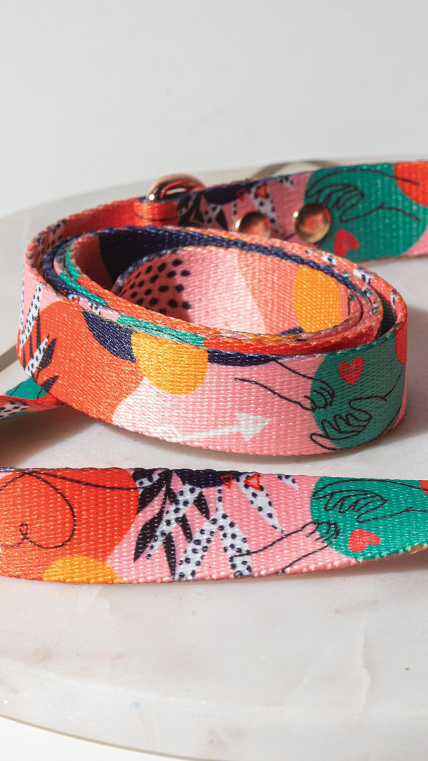 Close-up of the loop handle and dog-face print on a Love is a Four-Legged Word lead